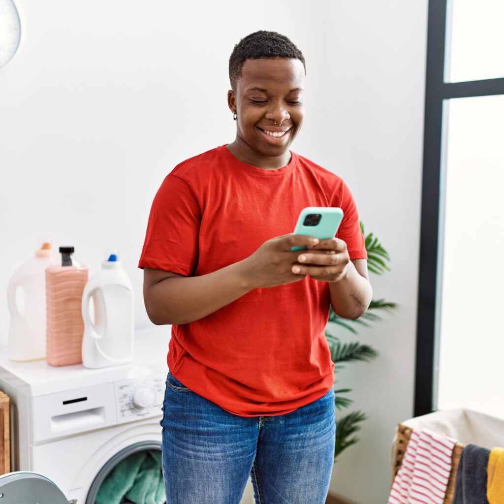 man smiling at phone